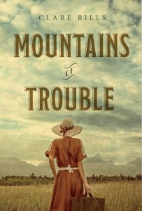 Cover art for Mountains of Trouble. Woman in red dress looking toward mountains.